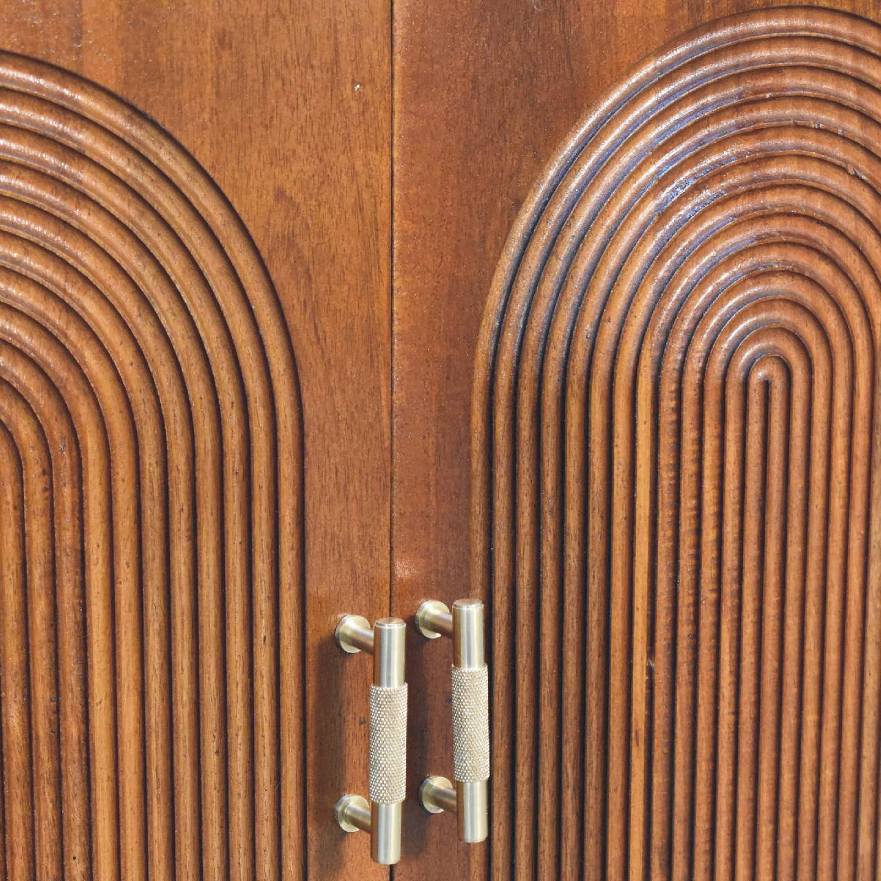 Wooden cabinet doors with metal handles.